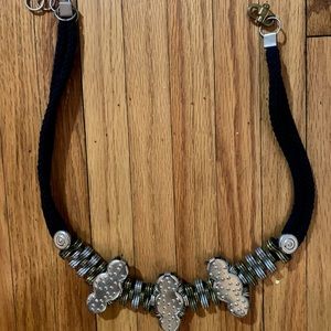 Black cord and metal accent belt, made in Israel. 29” in length.